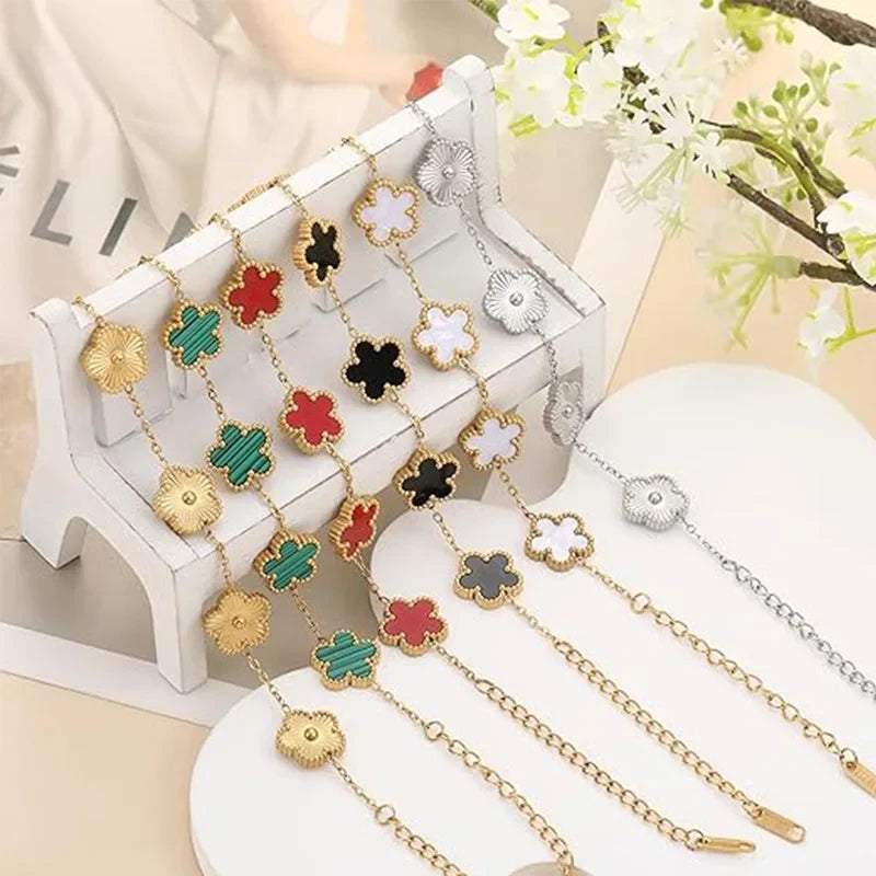 Double Sided Clover Charm Bracelet featuring gold and silver tones with various colored clover charms on display.
