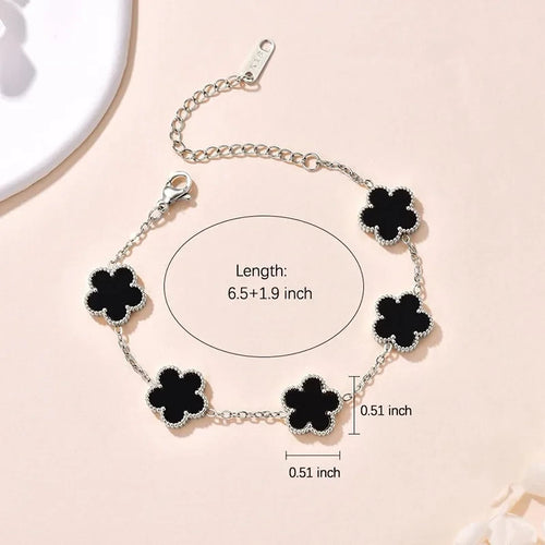 Double Sided Clover Charm Bracelet featuring elegant black clover charms on a silver chain, perfect for casual styling.