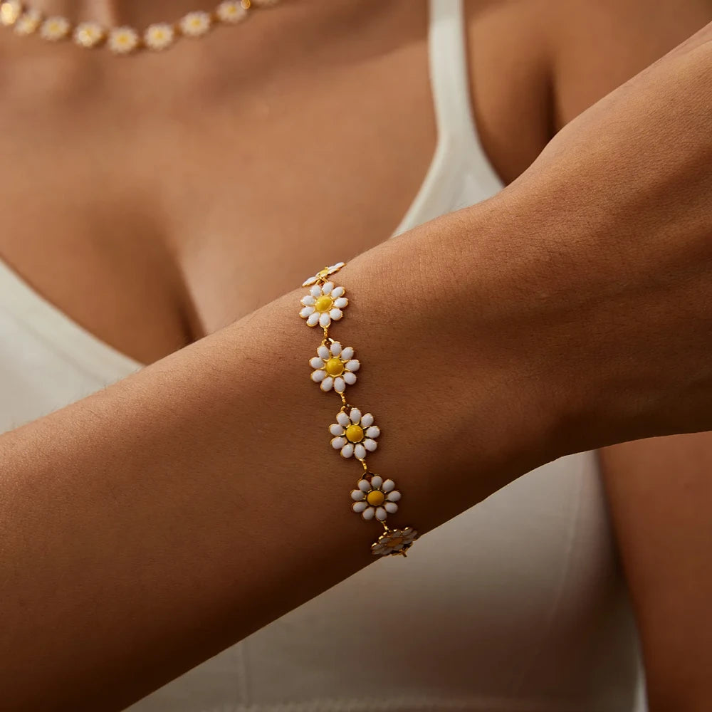 Minimalist Daisy Flower Charm Bracelet worn on a woman's wrist, showcasing its delicate daisy-inspired design.