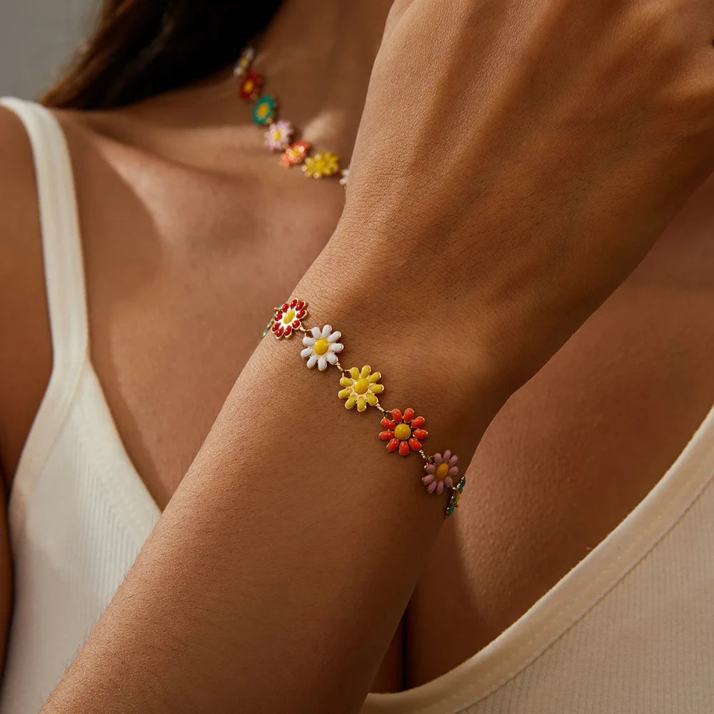 Minimalist Daisy Flower Charm Bracelet worn on a wrist, showcasing colorful daisy charms and a trendy design.