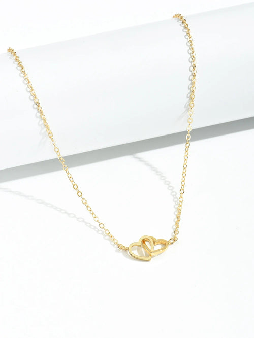Double Hollow Heart Chain Necklace featuring a delicate double hollow heart design on a gold chain.
